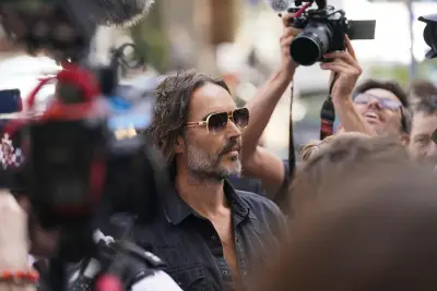 Russell Brand granted conditional bail after appearing in London court on rape and assault charges