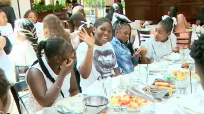 100 underserved children treated to lunch at Joe’s Stone Crab