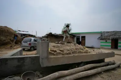 India fires missiles across the frontier with Pakistan, killing at least 1 child, officials say