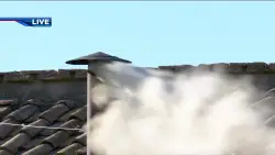 White smoke pours out of the Sistine Chapel chimney, signaling the election of a new pope